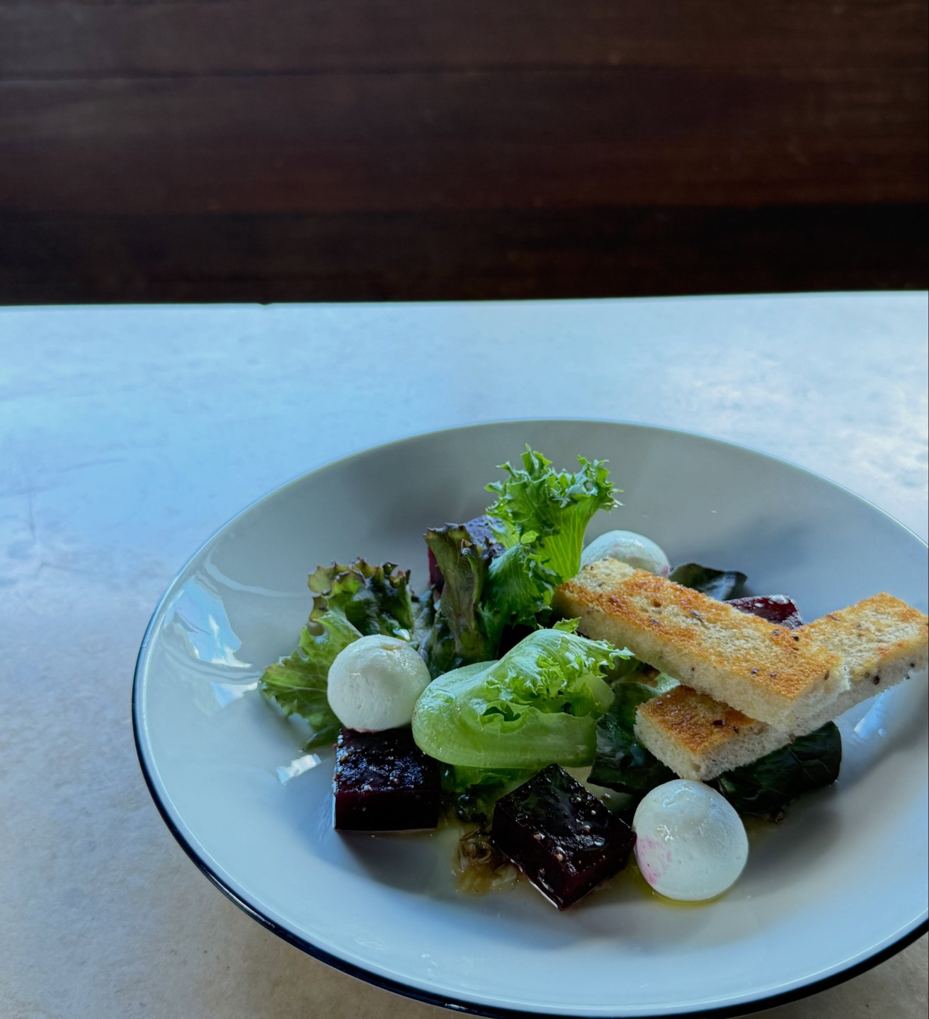 Beets and chèvre at Hopfields with baby lettuce and rye toast