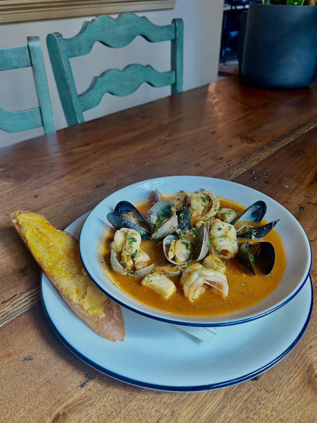 Classic bouillabaisse at Hopfields with clams, mussels and shrimp, and a baguette crouton