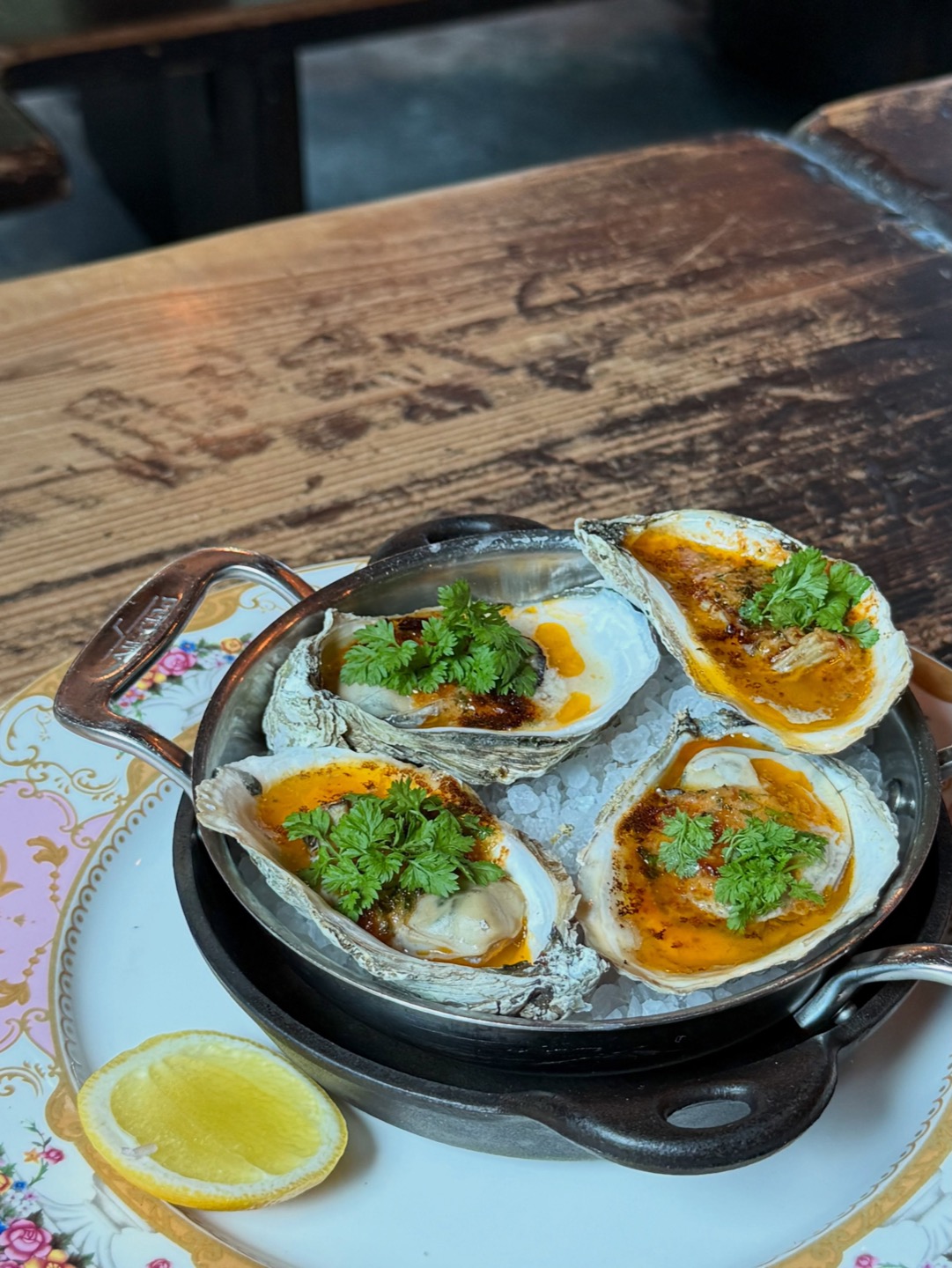 Broiled oysters at Hopfields with smoked tomato butter and chervil